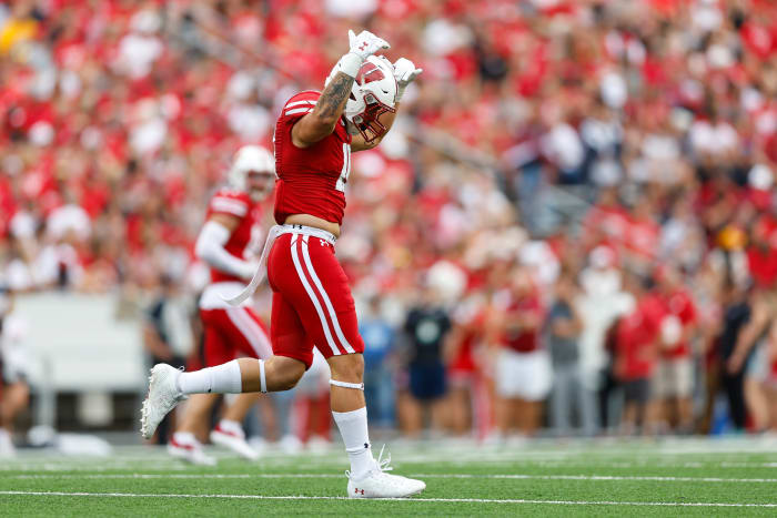 Wisconsin linebacker Nick Herbig pumps up the crowd after a sack.